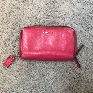 Pink coach wallet is used has a few stains